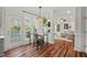 Bright dining area with large windows, a glass table, and access to the outdoor patio at 1216 Caribou Xing, Durham, NC 27713