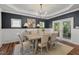 Charming dining room featuring a chandelier, neutral colors, hardwood floors, and lots of natural light at 1216 Caribou Xing, Durham, NC 27713