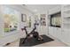 Bright exercise room with large window and built-in shelving at 1216 Caribou Xing, Durham, NC 27713
