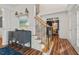 Bright foyer with a staircase and a glimpse into the adjacent office at 1216 Caribou Xing, Durham, NC 27713