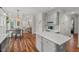 Open concept kitchen with an island, modern finishes, and seamless flow to dining and living areas at 1216 Caribou Xing, Durham, NC 27713