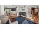 Open-concept living area with a dining table, staircase, and modern decor at 1216 Caribou Xing, Durham, NC 27713