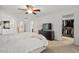Airy main bedroom with closet access, carpeted floors, and ceiling fan at 1216 Caribou Xing, Durham, NC 27713