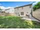 Spacious backyard with lush grass and a patio, perfect for outdoor entertaining and relaxation at 12433 N Exeter Way, Durham, NC 27703