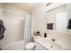 Bathroom featuring a shower/tub combo, toilet, sink and decorative mirror at 12433 N Exeter Way, Durham, NC 27703