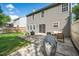 Back exterior elevation showcasing a large backyard, patio and green space at 12433 N Exeter Way, Durham, NC 27703