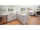 Modern kitchen with stainless steel appliances and a convenient island for meal preparation at 12433 N Exeter Way, Durham, NC 27703