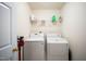Laundry room with washer, dryer, shelving, and space-saving potential at 12433 N Exeter Way, Durham, NC 27703
