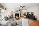 Cozy living room features a fireplace, ceiling fan, and comfortable seating for relaxation at 12433 N Exeter Way, Durham, NC 27703