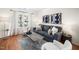Comfortable living room with neutral tones, contemporary decor, and lots of natural light at 12433 N Exeter Way, Durham, NC 27703