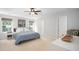 Calming main bedroom retreat with ample natural light, a ceiling fan, and neutral tones for relaxation at 12433 N Exeter Way, Durham, NC 27703