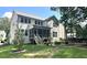 Spacious backyard with a fire pit, perfect for outdoor entertaining with a charming screened porch and lush landscaping at 127 Sanderway Dr, Chapel Hill, NC 27516