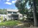 This home features a spacious backyard with a screened porch, a fire pit area and a charming hammock at 127 Sanderway Dr, Chapel Hill, NC 27516