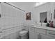 A bathroom with a patterned shower curtain, a toilet, and a modern vanity at 127 Sanderway Dr, Chapel Hill, NC 27516