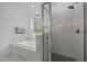 Bathroom with a soaking tub, walk in shower and large tiles at 127 Sanderway Dr, Chapel Hill, NC 27516