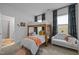 A cheerful ' bedroom with a bunk bed, white couch, and colorful rug at 127 Sanderway Dr, Chapel Hill, NC 27516