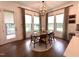 Charming dining area featuring modern lighting fixtures, large windows and modern decor at 127 Sanderway Dr, Chapel Hill, NC 27516