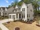 Charming two-story home boasts professional landscaping, a 2-car garage, and brick accents at 127 Sanderway Dr, Chapel Hill, NC 27516