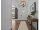 View of foyer featuring hardwood floors, pendant lighting, and front door at 127 Sanderway Dr, Chapel Hill, NC 27516
