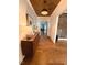 View of the foyer with wood floors, decorative console table, and view into other rooms at 127 Sanderway Dr, Chapel Hill, NC 27516