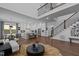 Open floor plan showcases a living room, kitchen, and staircase at 127 Sanderway Dr, Chapel Hill, NC 27516