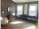 Bright living room boasts hardwood floors, ample natural light and a decorative rug at 127 Sanderway Dr, Chapel Hill, NC 27516