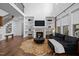 Living room showcasing a modern fireplace, built-in shelves, and staircase at 127 Sanderway Dr, Chapel Hill, NC 27516