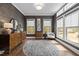 Living room with lots of natural light, modern furnishings, and round carpet at 127 Sanderway Dr, Chapel Hill, NC 27516