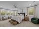 Spacious bedroom with neutral tones, large windows, and cozy seating area at 127 Sanderway Dr, Chapel Hill, NC 27516