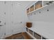 Organized mud room with storage cubbies, hooks, and a wooden bench at 127 Sanderway Dr, Chapel Hill, NC 27516