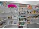 Well-organized walk-in pantry with custom shelving, offering ample storage space for groceries and household items at 127 Sanderway Dr, Chapel Hill, NC 27516