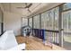 A relaxing screened porch with a white sofa, a playhouse, and an outdoor game at 127 Sanderway Dr, Chapel Hill, NC 27516