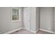 Bedroom featuring neutral walls, trim and a window at 1284 Railroad St, Henderson, NC 27536