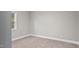 Neutral bedroom with a window letting in natural light and carpet flooring at 1284 Railroad St, Henderson, NC 27536