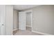 Neutral bedroom with carpet floors, open door, and base trim at 1284 Railroad St, Henderson, NC 27536