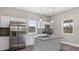Modern kitchen boasting stainless steel appliances, granite countertops, and bright white cabinets at 1284 Railroad St, Henderson, NC 27536