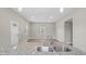Granite counter with stainless faucet overlooking a naturally-lit living area at 1284 Railroad St, Henderson, NC 27536