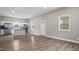 Open-concept living space with lots of natural light flowing into the connected kitchen area at 1284 Railroad St, Henderson, NC 27536