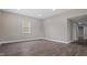 Open living room with hard surface floors and abundant natural light at 1284 Railroad St, Henderson, NC 27536