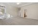 Carpeted bedroom with access to an outdoor patio, and a private bathroom at 1307 Seattle Slew Ln, Cary, NC 27519