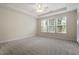 Spacious carpeted bedroom with large windows that allow for lots of natural light at 1307 Seattle Slew Ln, Cary, NC 27519