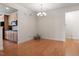Open dining room with chandelier lighting adjacent to the kitchen at 1307 Seattle Slew Ln, Cary, NC 27519