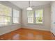 Bright dining room with hardwood floors and three large windows at 1307 Seattle Slew Ln, Cary, NC 27519