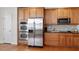 Gourmet kitchen with stainless steel appliances, double ovens, and custom wood cabinetry at 1307 Seattle Slew Ln, Cary, NC 27519