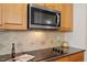 Modern kitchen with stainless steel microwave and ceramic cooktop at 1307 Seattle Slew Ln, Cary, NC 27519