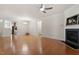 Spacious living room with fireplace, hardwood floors, and open floor plan at 1307 Seattle Slew Ln, Cary, NC 27519
