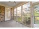The sun room is a brick enclosure with lots of windows for light, and a door for access at 1307 Seattle Slew Ln, Cary, NC 27519