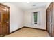 Cozy bedroom with wooden floors, closet, a window offering natural light and simple design at 1400 Rainwood Ln, Raleigh, NC 27615