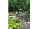 Relaxing outdoor deck space surrounded by lush greenery and mature trees at 1425 Bascomb Dr, Raleigh, NC 27614