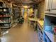 Spacious basement area with storage, table, and exposed ceiling features at 1425 Bascomb Dr, Raleigh, NC 27614